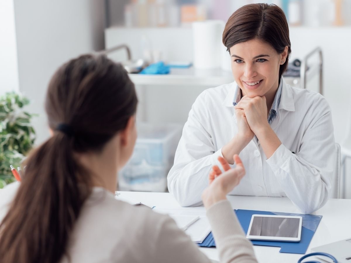 Person in a calm consultation representing seeking professional support for physical symptoms of anxiety.