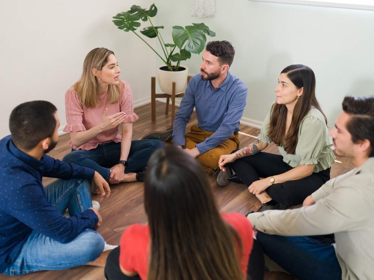 People having an open and supportive conversation representing the growing shift in mental health attitudes in Pakistan.